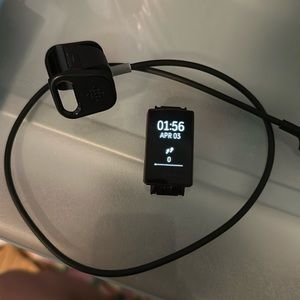 Purple Fitbit charge 3 pebble with charger